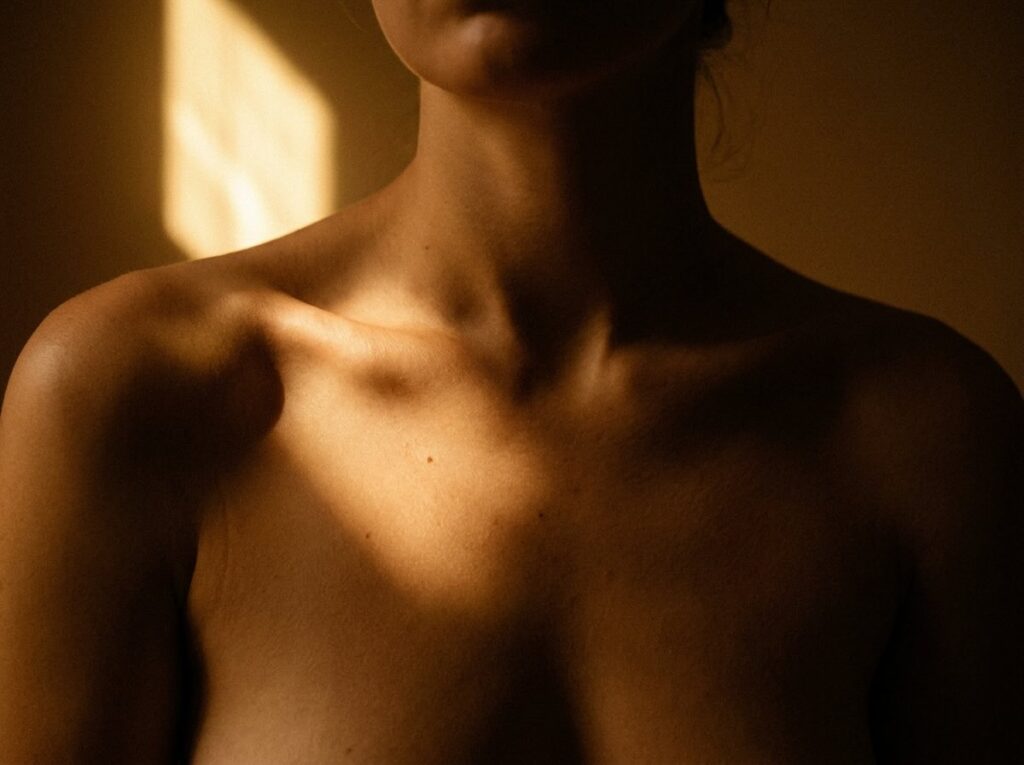 Décolletage and collarbone in warm afternoon light, premium editorial skin barrier repair guide