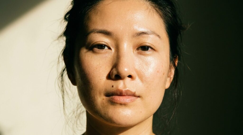 glass skin routine result showing luminous dewy face in warm morning light
