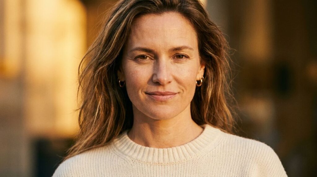 Woman with firm resilient skin in golden hour light showing results of consistent peptide use